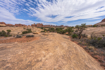 hiking the chesler park loop trail in the needles in canyonlands national park, usa