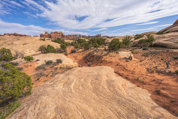 hiking the chesler park loop trail in the needles in canyonlands national park, usa