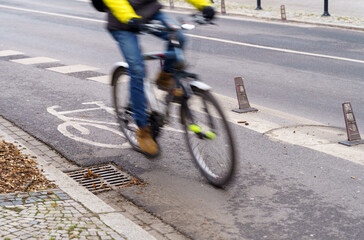 Fototapeta na wymiar The cyclist travels on a bicycle path.