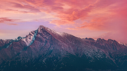 Pink purple afternoon clouds sky over mount Krivan peak - Slovak symbol - forest trees silhouettes...