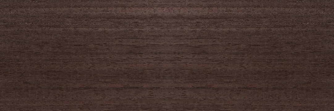 Texture of mahogany. Texture of koto wood with a reddish brown tint. Exotic rare wood from Africa for the production of expensive furniture or interior elements