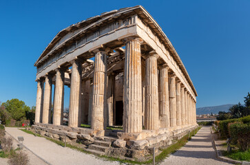 Fototapeta na wymiar The Temple of Hephaestus in ancient market (agora) under the rock of Acropolis, Athens, Greece.