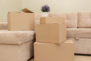 Cardboard boxes on the floor in the room. Concept of moving or delivery, sale or purchases