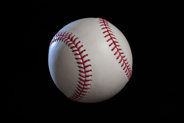 Baseball with dramatic lighting isolated on a black background