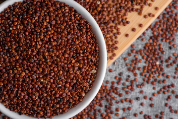 Red quinoa grains. Healthy vegan food concept. Chenopodium quinoa.