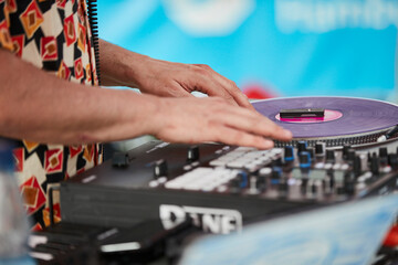 DJ hands with turntable and miixer