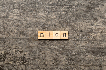 BLOG word written on wood block. BLOG text on cement table for your desing, concept