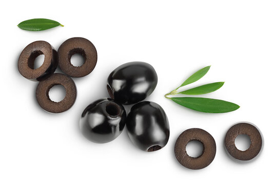 Black olives with leaves isolated on a white background with full depth of field. Top view. Flat lay