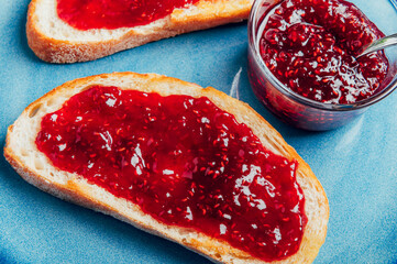 Open Sandwich with toasted sourdough white bread slices and raspberry jam