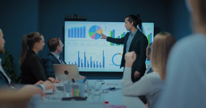 marketing expert presenting report and strategy of sales in business meeting in office, 4K, Prores