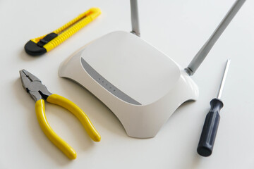 Repairing tools with a wireless wifi router on the table.