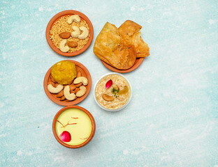 top view of colorful traditional holi powder in bowls isolated on dark background.Space for text . happy holi.Concept Indian color festival called Holi