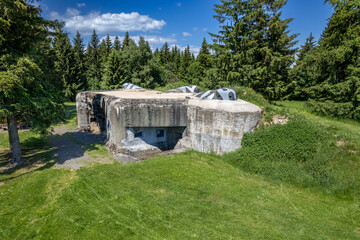 A concrete blockhouse of the former czechoslovak fortification in Orlicke hory with visible plated...
