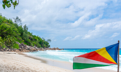 Seychelles flag by the sea in Anse Georgette