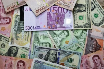 Banknotes of different countries, colored background