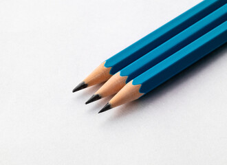 A set of pencils on a paper background. Close up. Macro.