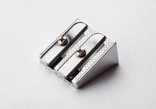 Pencil sharpener on paper background. Close up. Macro.