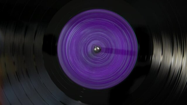 Black vinyl Retro with yellow color violet in center record on DJ turntable. 