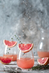 Fresh summer drink with grapefruit and thyme
