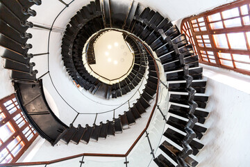 Upside view of a spiral metal staircase in the water tower