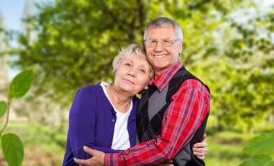Happy senior old couple together in garden
