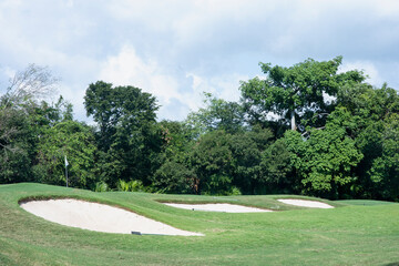 A swing across the greens with bunkers at a golf club in Mexico