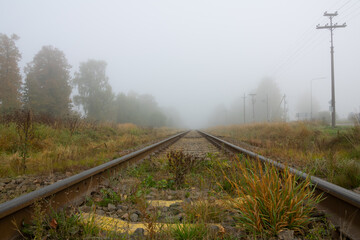 Fototapeta na wymiar Railway line in the fog