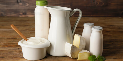 Different dairy products on wooden background