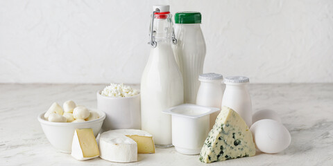 Fototapeta na wymiar Different dairy products on light background