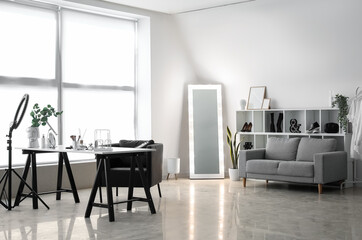 Naklejka na ściany i meble Interior of light makeup room with table, mirror and sofa