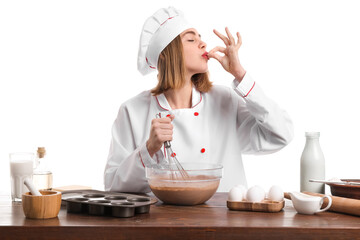 Female baker making dough at table on white background