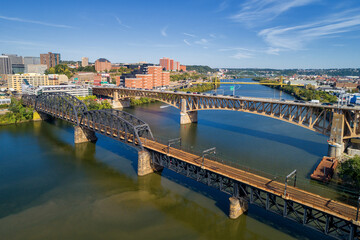 Fototapeta premium Pittsburgh Skyline with Downtown and Business District. Train Bridge and Liberty Bridge.