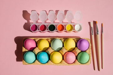 A tray with pastel-colored Easter eggs. Preparation for the celebration of the religious holiday of Holy Easter