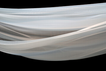 Sheer white fabric blown in the wind. Part of decorations of an outdoor wedding location.