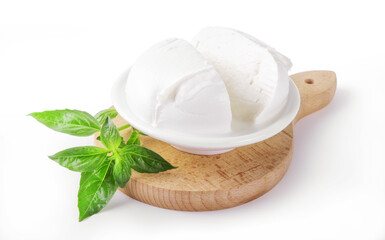 Buffalo mozzarella and basil on cutting board isolated on white background, closeup..