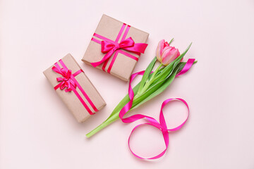 Composition with beautiful tulip flower and gifts for Women's Day celebration on color background