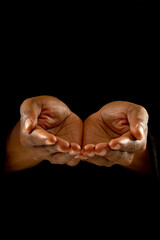 Image of close up of hands of african american woman praying
