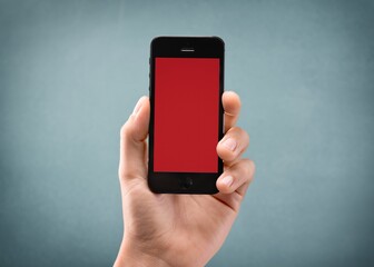 Hands hold a phone with a blank screen
