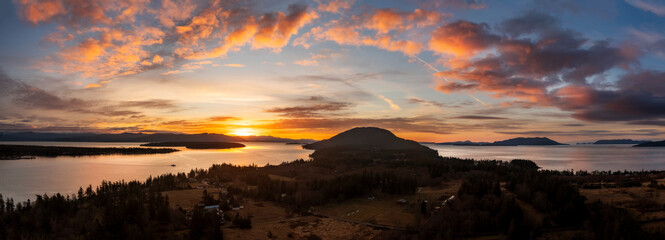 Dramatic Sunset Over Lummi Island, Washington. Aerial view of the south end of Lummi Island located...
