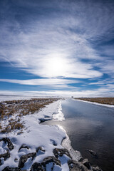 unfrozen canal in winter