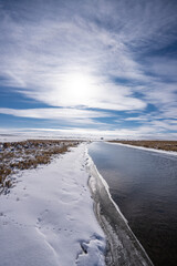unfrozen canal in winter