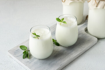 Glass cup of Turkish traditional drink ayran , kefir or buttermilk made from yogurt, healthy food