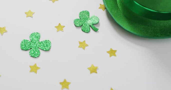 Shamrocks and stars with green hat with copy space on white background