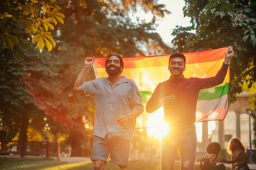 Bisexual couple walking with pride flag