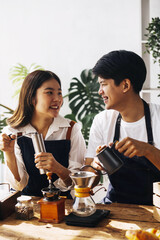 Image of newlywed couple cooking at home. Asia young couple cooking together with Bread and fruit in cozy kitchen in home