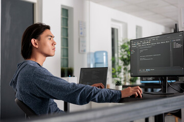 It engineer using programming computer to write html code on terminal window, creating new web interface at desk table. Coder working and parsing system algorithm in big data office, it server.