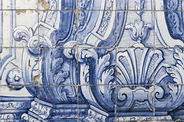 Detail of vintage Portuguese ceramic tiles. Old blue azulejo facade with decorative floral ornaments. Baroque styled pattern. Antique building wall fragment. Artistic hand drawn decorative background - obrazy, fototapety, plakaty