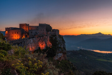 Panoramic view of Caccamo castle at dusk, province of Palermo IT - 574469435