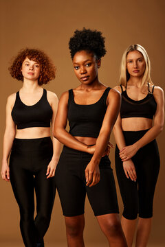 Three Multiracial Girls In Underwear With Pure Natural Skin With No Makeup Posing In Studio.