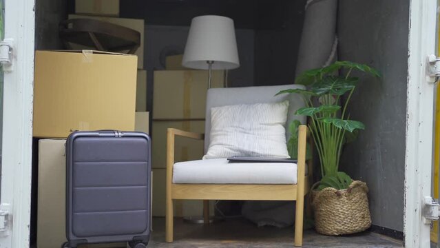 Truck car moving house for customers, delivering boxes and furniture. Vehicle transportation. Shipping and packaging business occupation service company. People lifestyle.